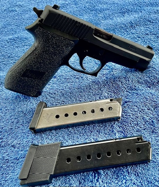 Sig Sauer P220 w two mags.jpg